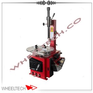 دستگاه لاستیک درآر سه پدال پولی در حال جداسازی لاستیک از رینگ خودرو، با طراحی صنعتی و سه پدال برای کارایی بهتر.